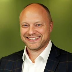 Man wearing a suit and smiling