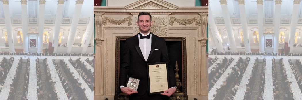 Photograph of Avery Alysworth with his Lombard Prize certificate