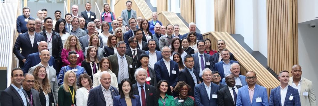 Photograph of DBA Conference attendees gathered on the main staircase at Waterside