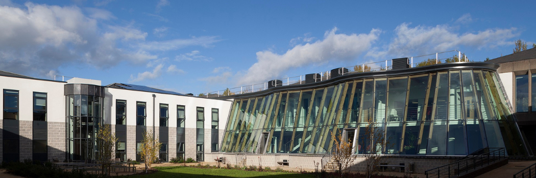 Business School building courtyard on a sunny day 1050x350