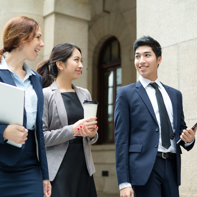 Three business people walking in the street