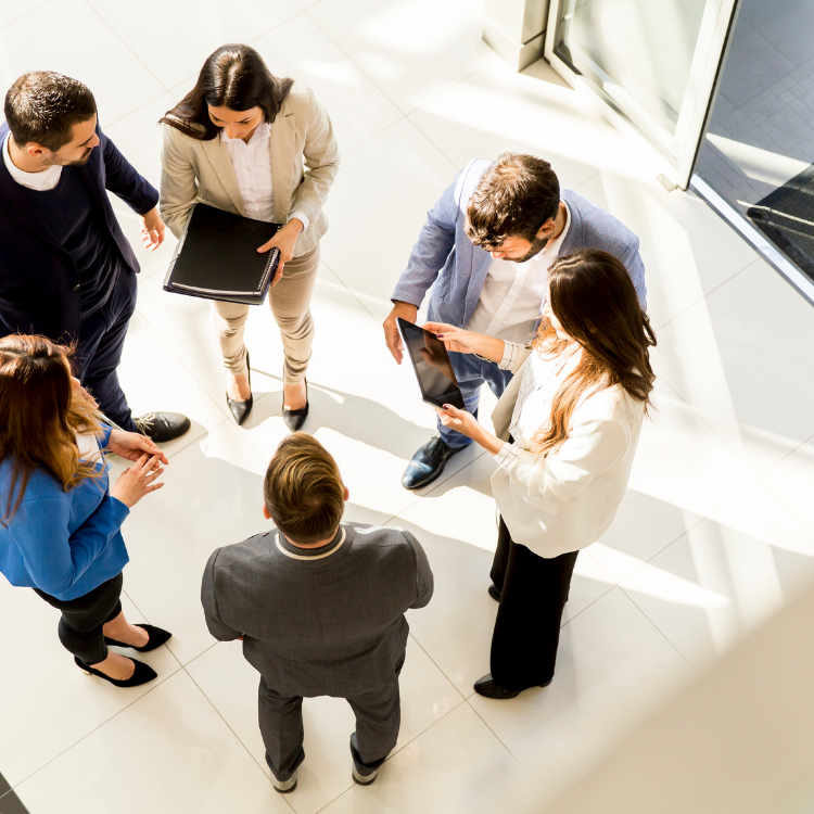 Six business people in a foyer viewed from above