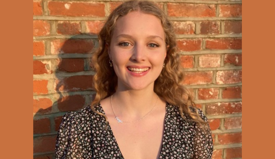 Head shot of female student with blonde curly hair
