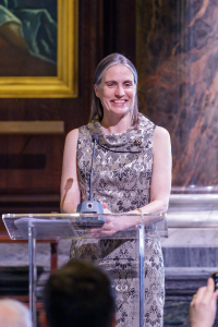 Dr Fiona Hill giving speech at a podium