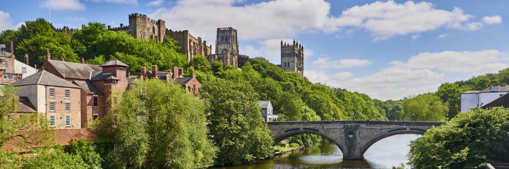 A view of Durham Cathedral and Castle on a sunny day
