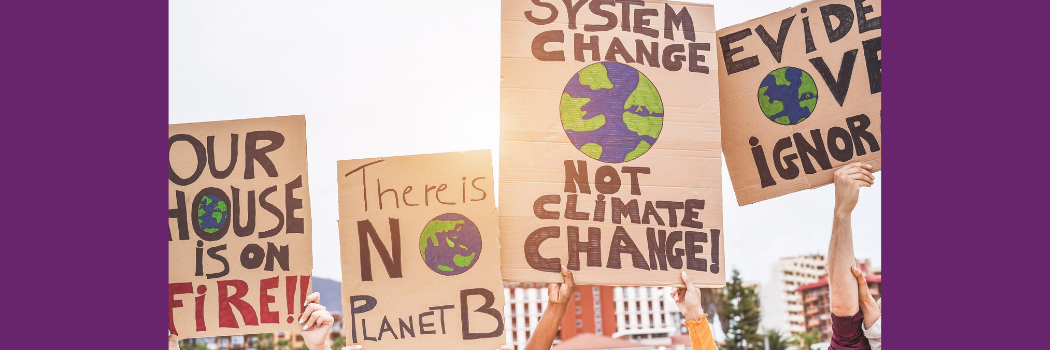 Group of demonstrators on road, young people from different culture and race fight for climate change - Global warming and environment concept - Focus on banners