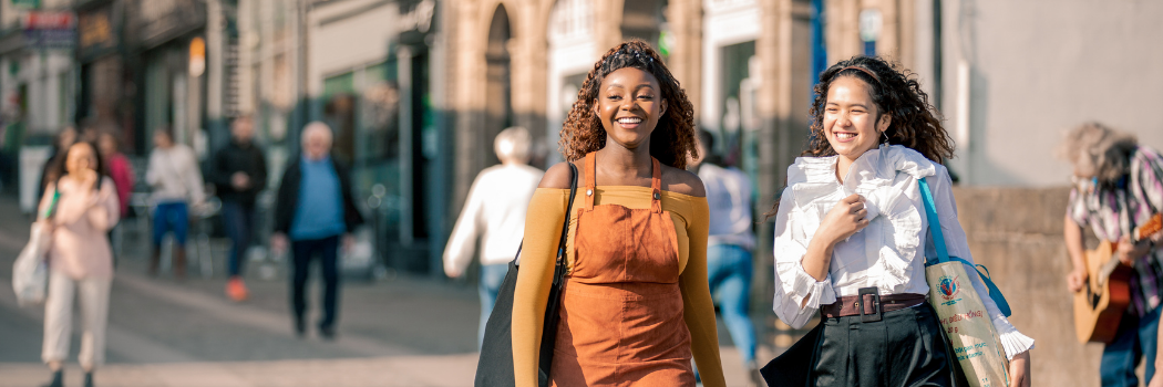 Two female students walking through Durham City