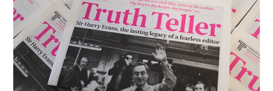A newspaper-style magazine with the headline 'Truth Tellers' in pink text and a black and white photograph of a man holding his left hand aloft