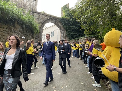 students walking amidst celebrations