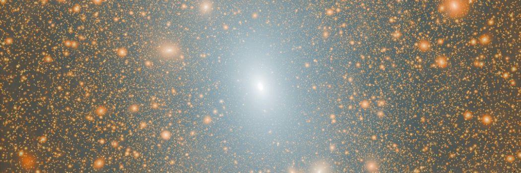 A simulation showing a bright white galaxy at the centre, surrounded by fainter galaxies, against a black backdrop.