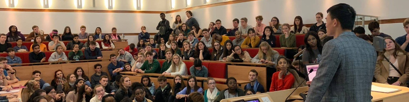 Yuk Chi Chan giving a lecture to a room full of students