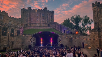 Students at a ball outside Durham Castle