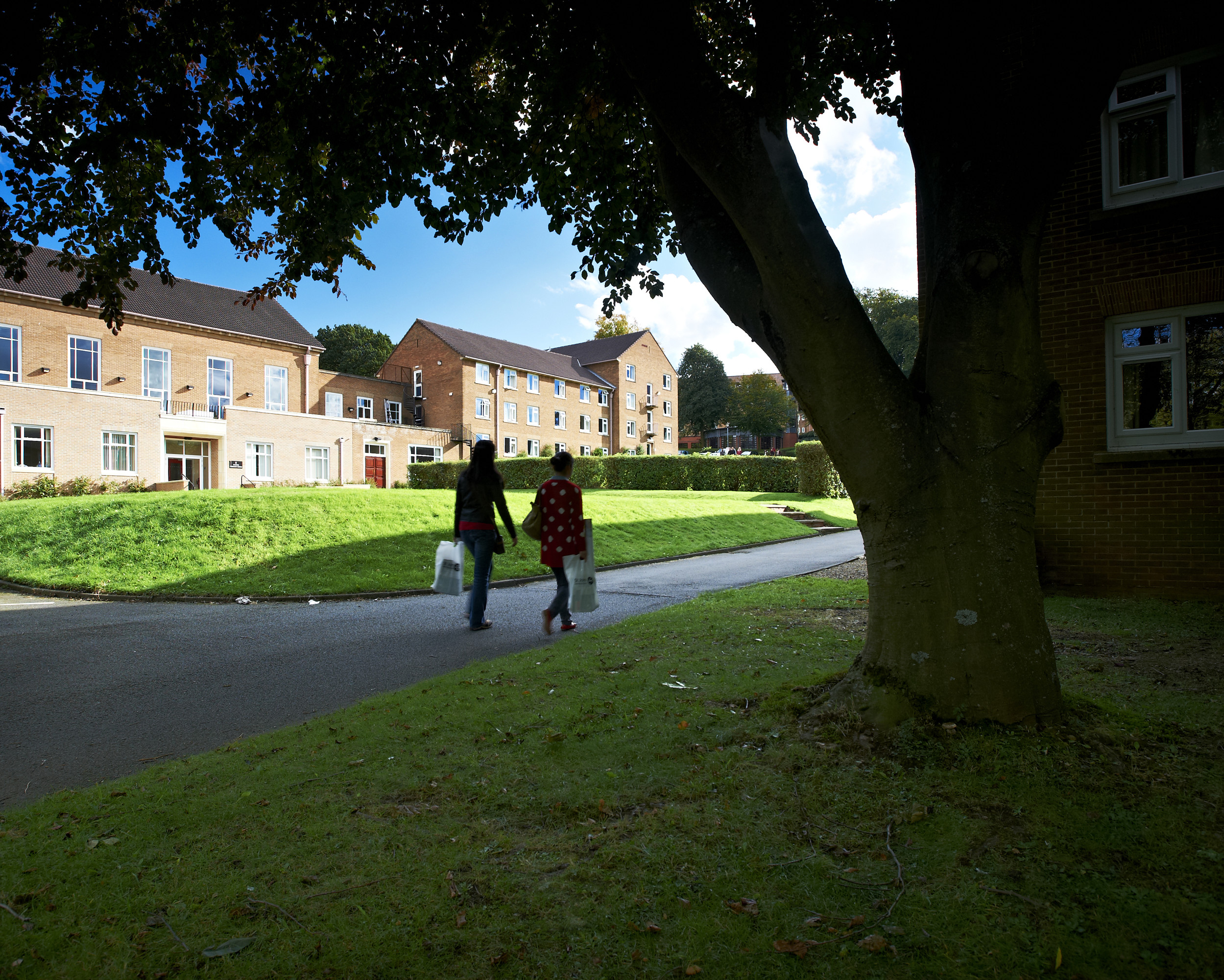Two students walking outside Grey College
