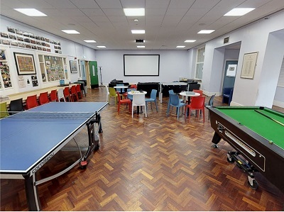 Student common room with a table tennis, pool table and group seating