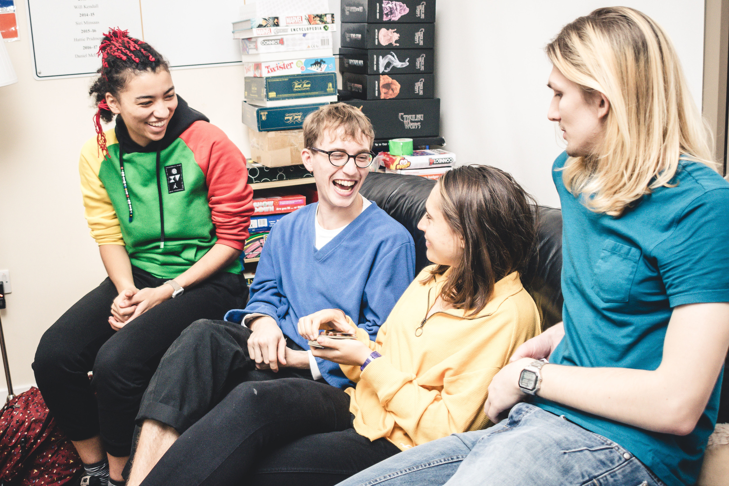 Students chatting and laughing in a shared common room