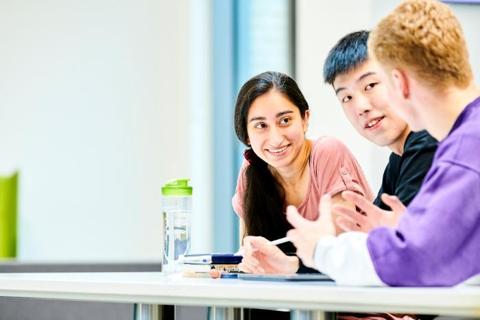 Three students working together