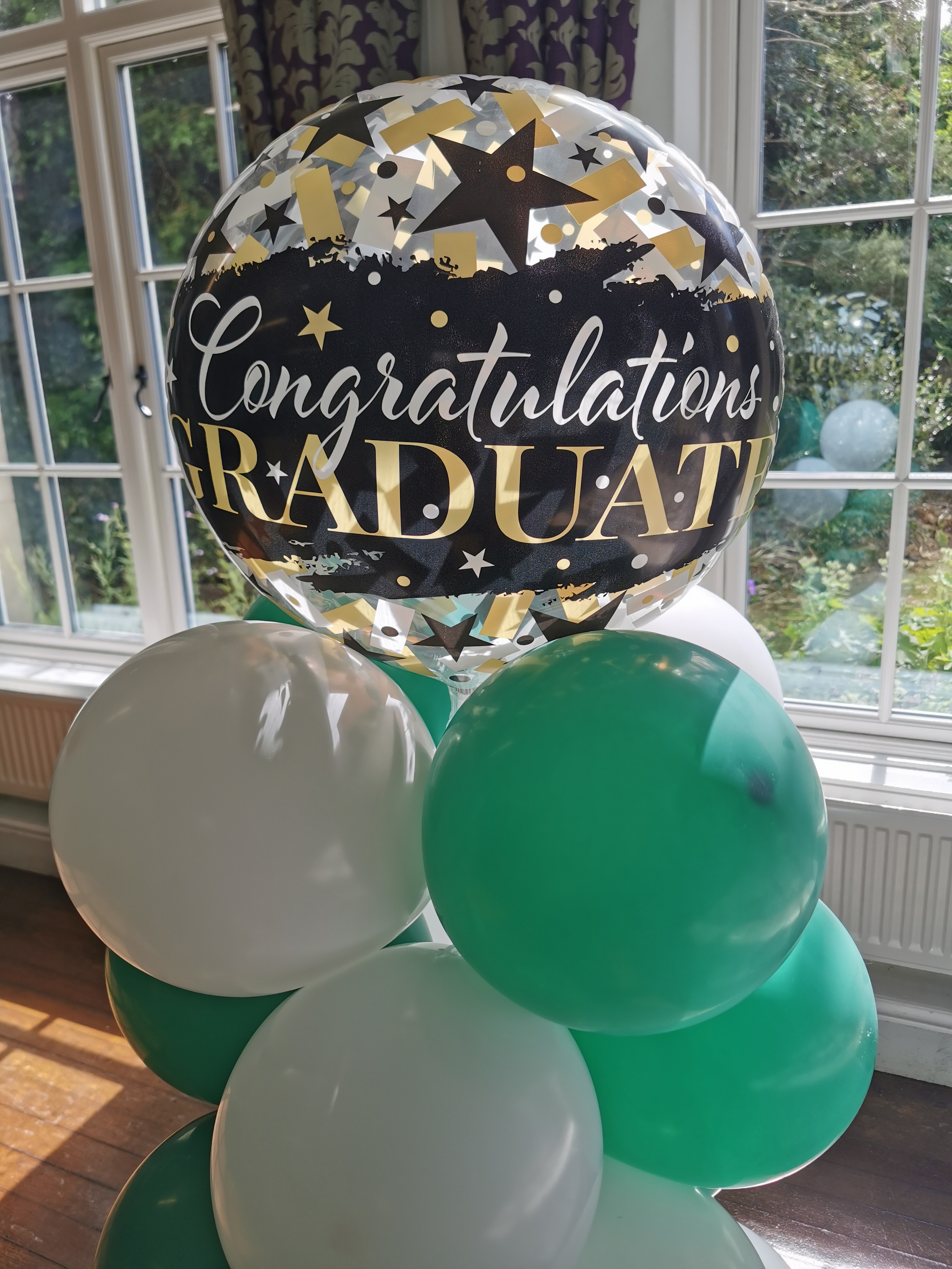 Congratulations Graduates balloons in green and white