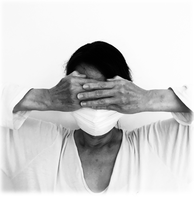 Woman in respirator mask covering her eyes