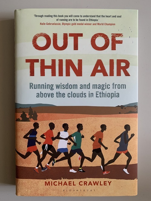 Book cover featuring runners in Ethiopia subtitled 'Running wisdom and magic from above the clouds in Ethiopia.