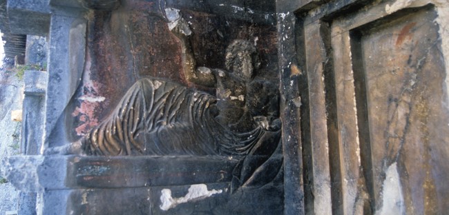 Relief sculpture on a tomb from southwest Turkey of a man reclining with a ceremonial pouring vessel