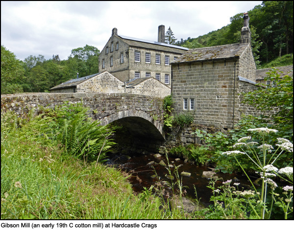 Stone nineteenth century stone cotton mill buildings and bridge