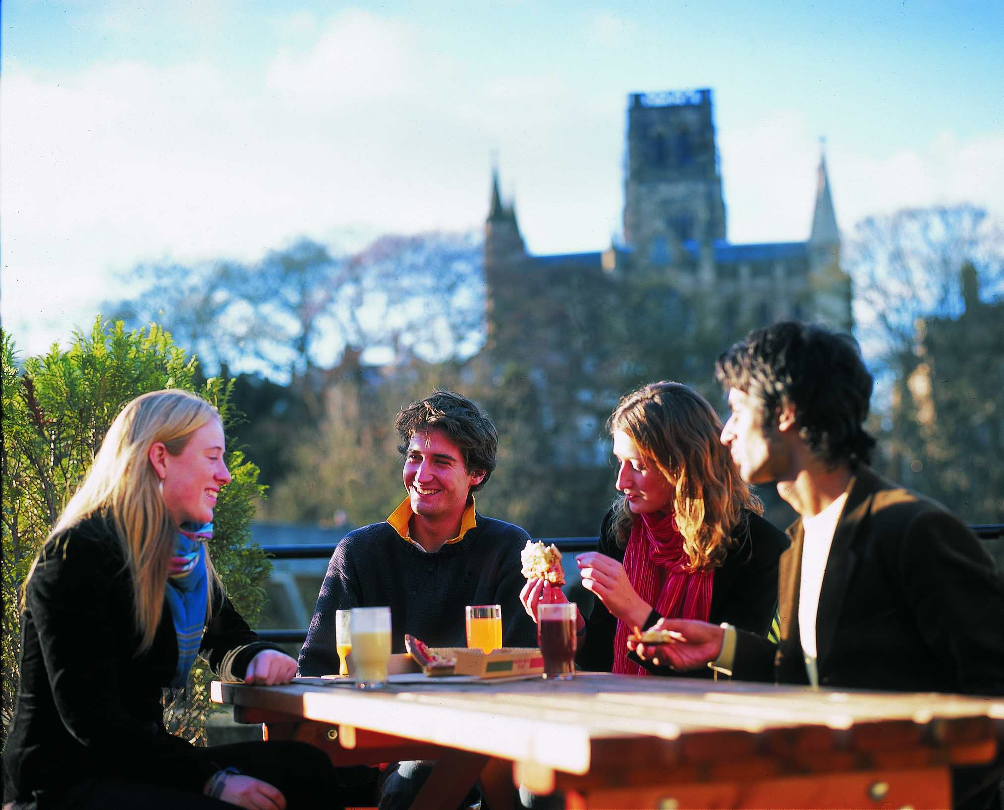 Students sitting with Durham Cathedral in the background