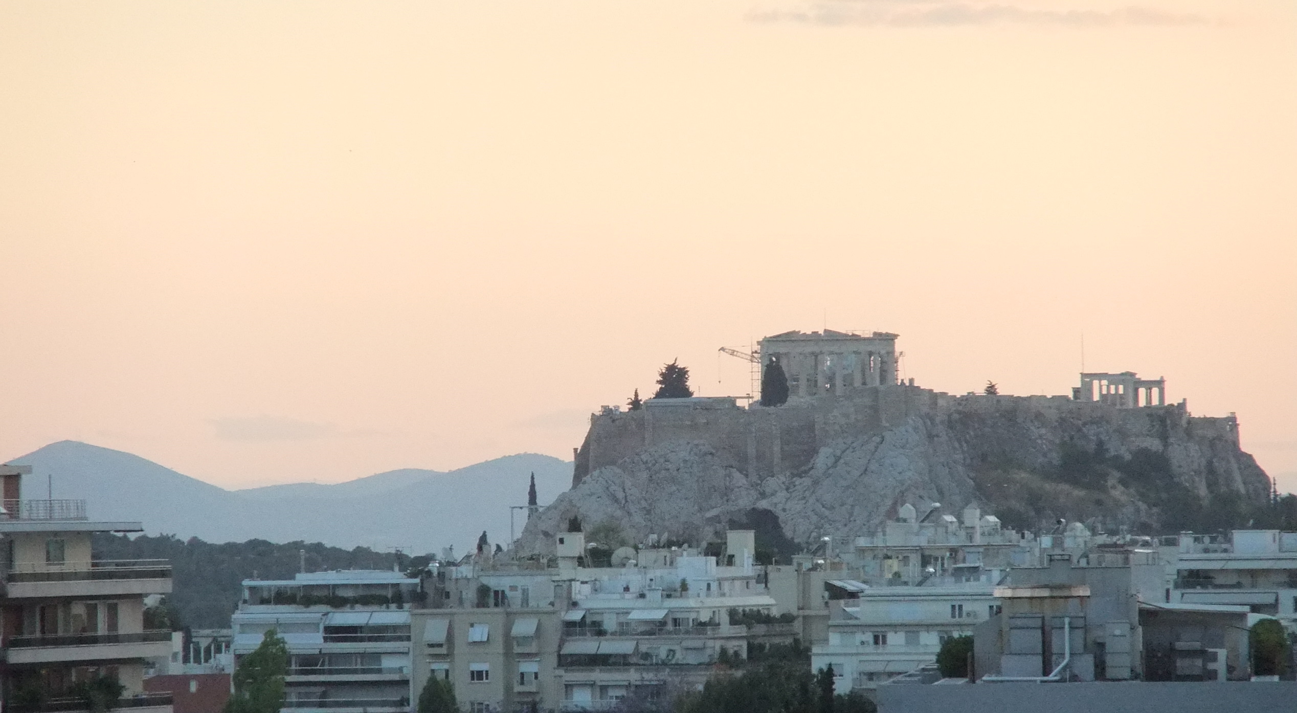 A photograph of the ancient temple on the hill above the city of Athens