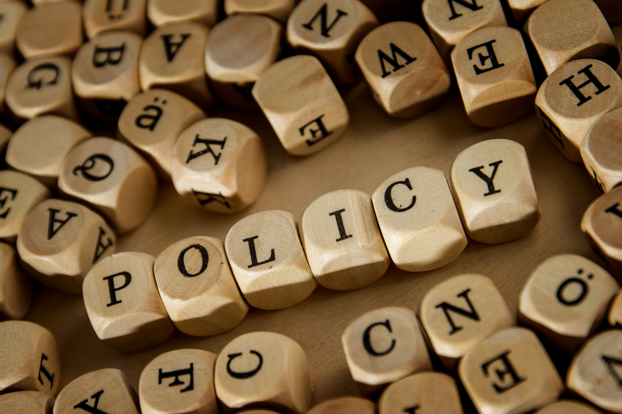 The word Policy written in lettered cubes