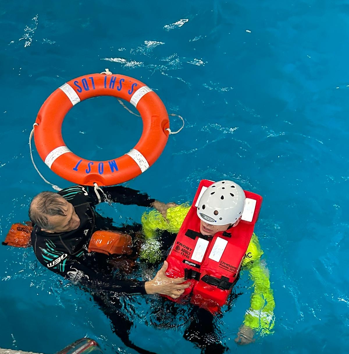 Student wearing sea survival gear in the water
