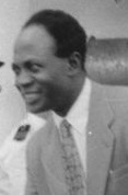 A black and white photo of a smiling Kwame Nkrumah