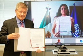 man holding a signed document