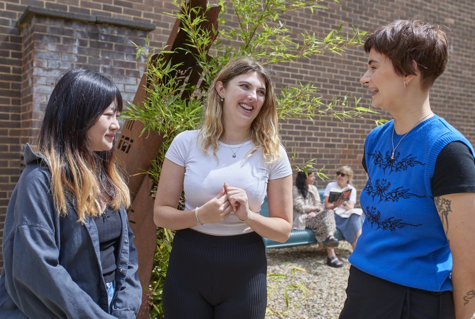 Group of students talking in the garden at Elvet Riverside