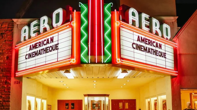 Colourful photograph of a cinema billboard displaying the word American Cinematheque