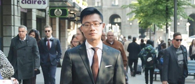 Alumni standing in the middle of a shopping street