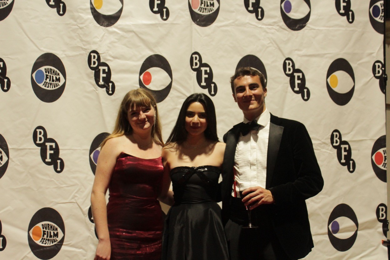 three people in front of the BFI logo