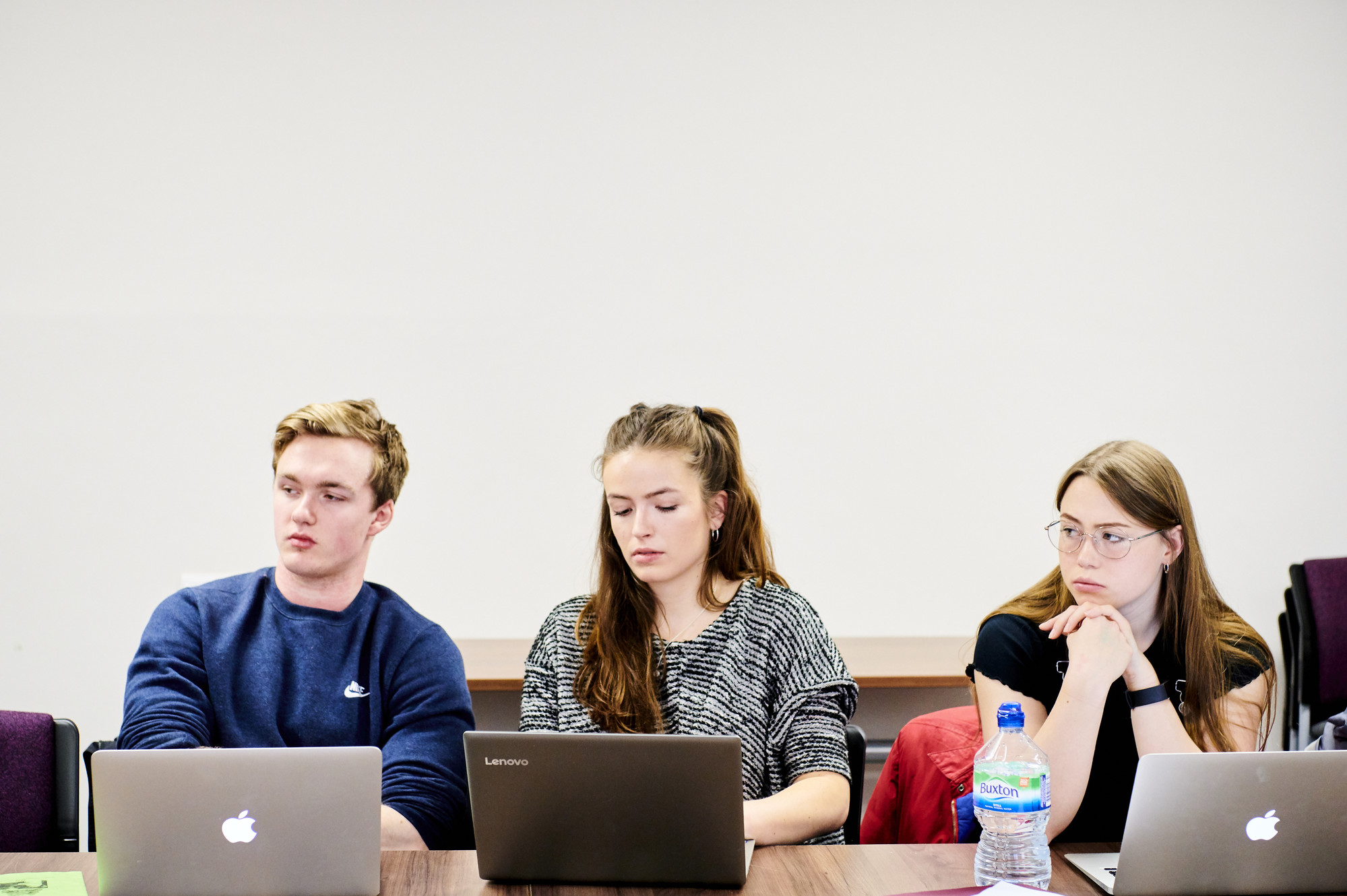 Students making notes in class