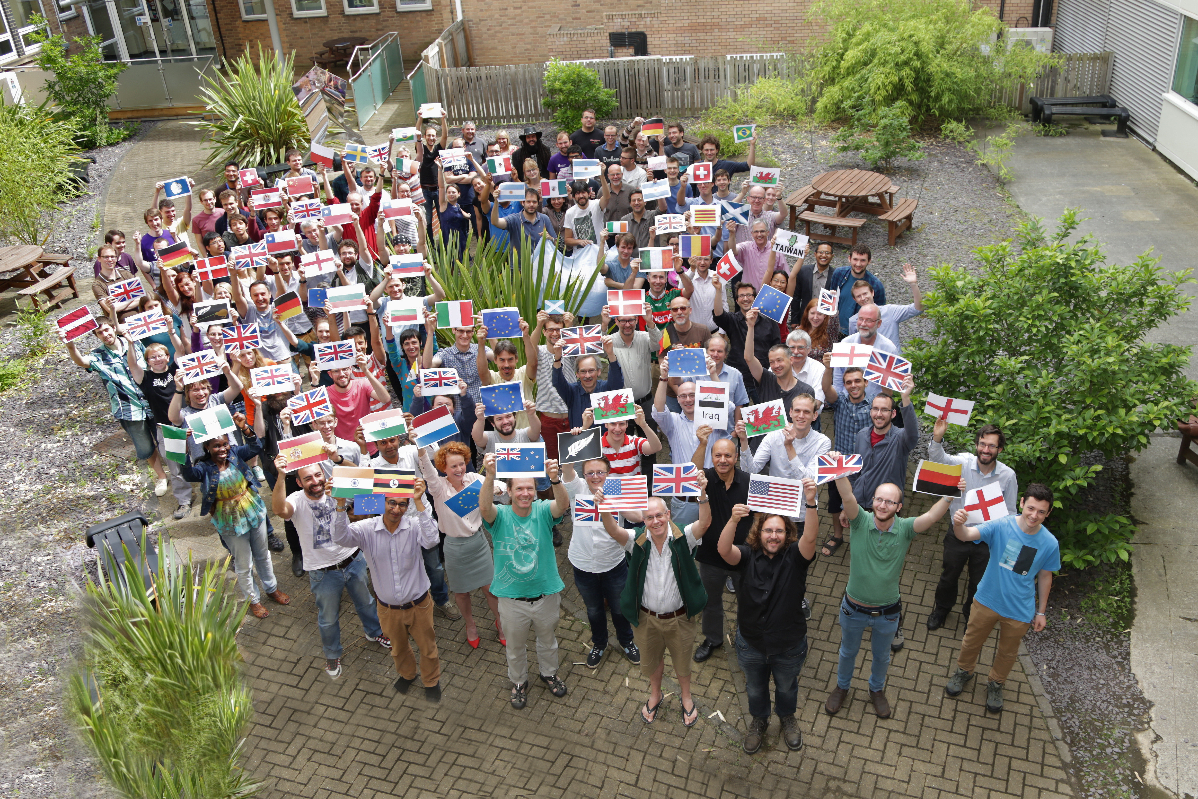 TGroup photo of Royal society holding flags