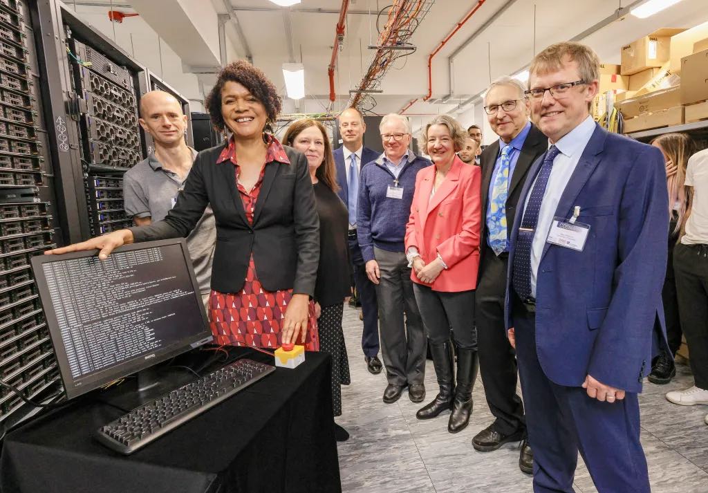 Photo of Chi Onwurah and various University academics posing with the new supercomputer