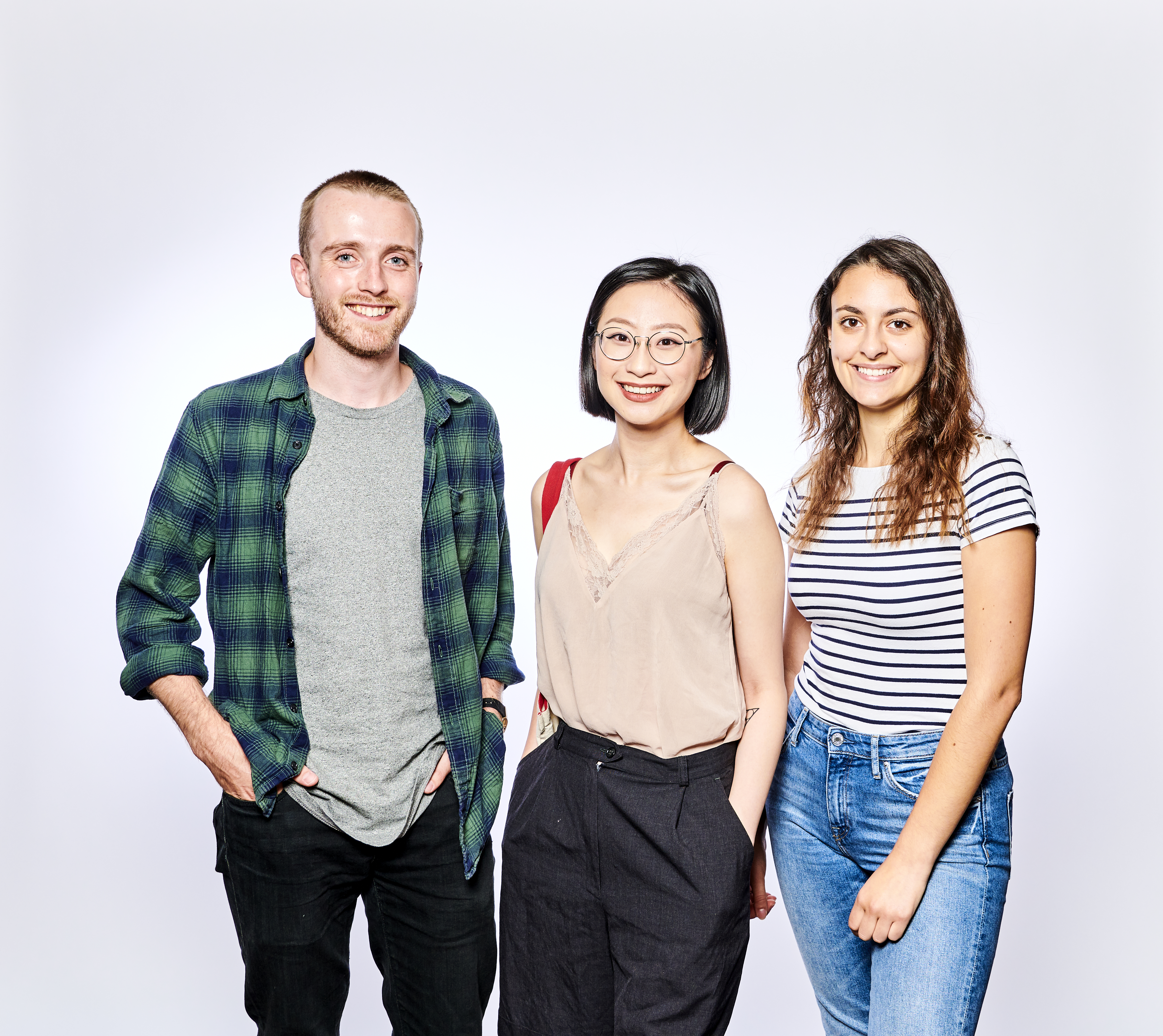 Three postgraduate students posing for photoshoot