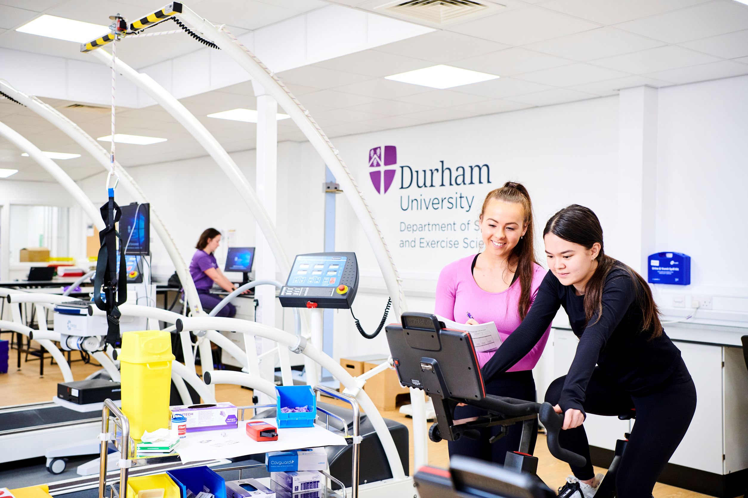 Two female students conducting research in a lab