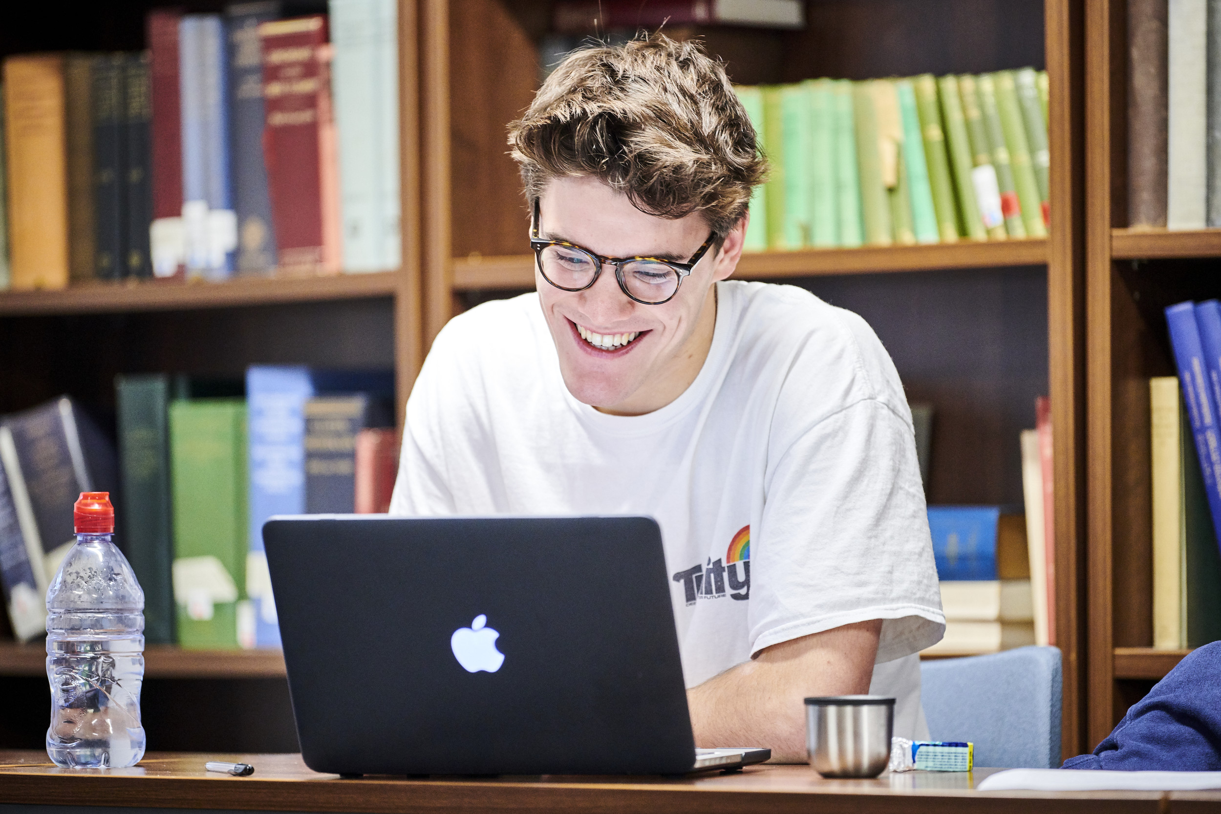 Student working on a laptop in the library