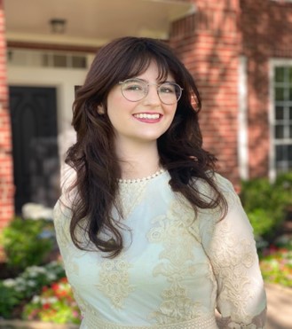 Female student with long brown hair and glasses