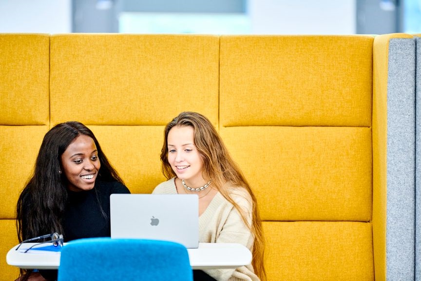 Two Students looking at laptop