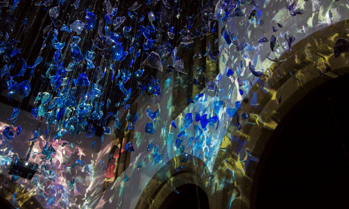 Art display of coloured plastic hung from the ceiling