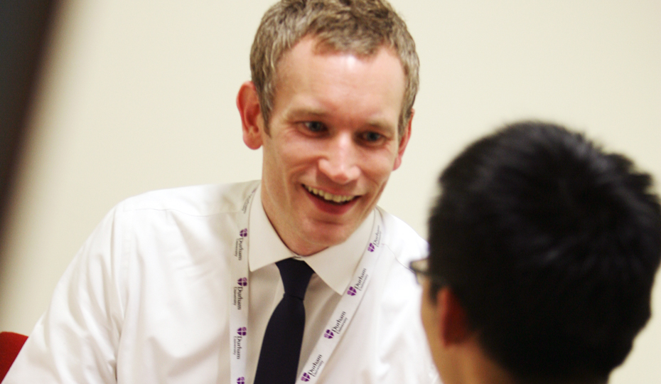 A staff member providing guidance in the Student Immigration and Financial Support Office