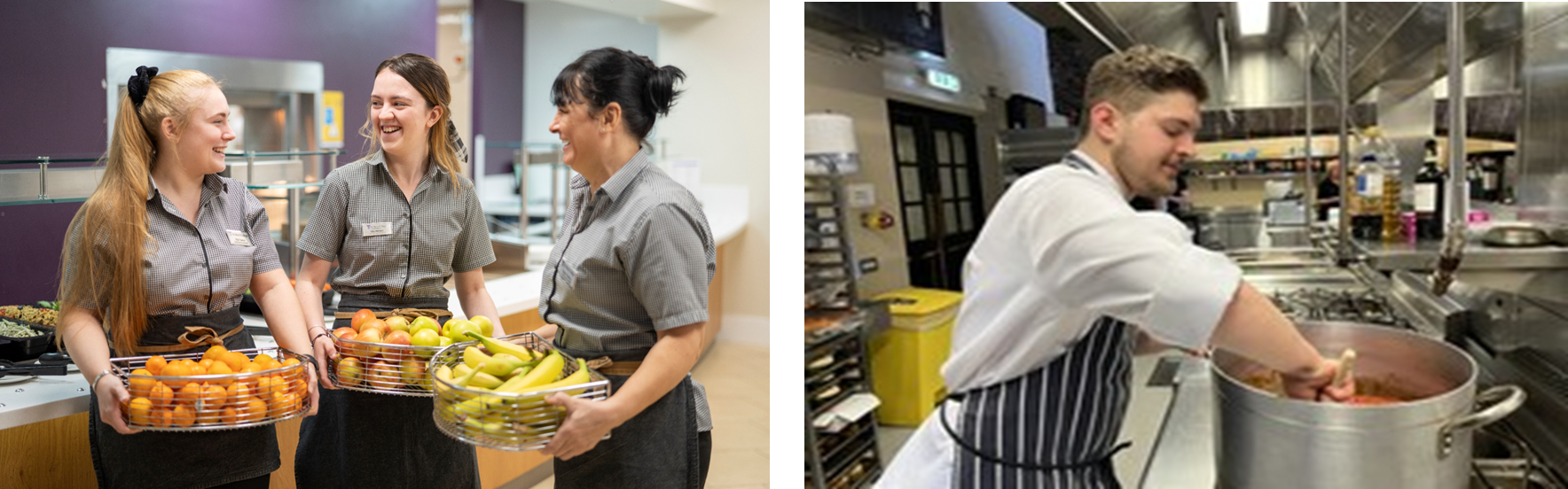 Three women in catering uniforms of black and white checked blouse and dark grey aprons stand in front a serving station and Young man with a beard, wearing chef whites and a blue and white striped apron, stirs food inside a large, stainless steel pot. He is inside a professional kitchen