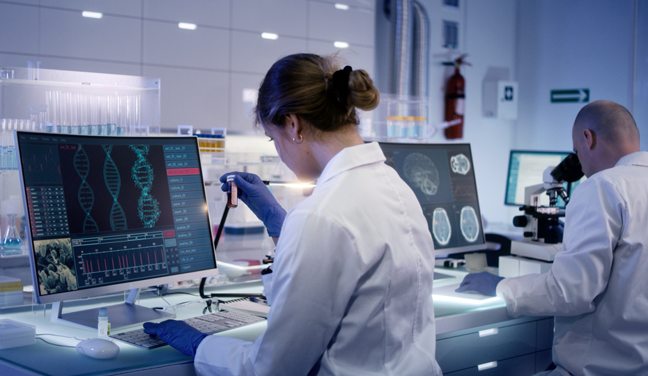 TScientists examine DNA models in modern Neurological Research Laboratory