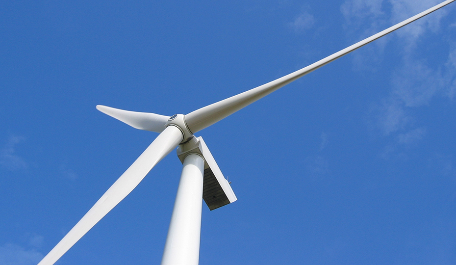 TA wind turbine against a clear blue sky