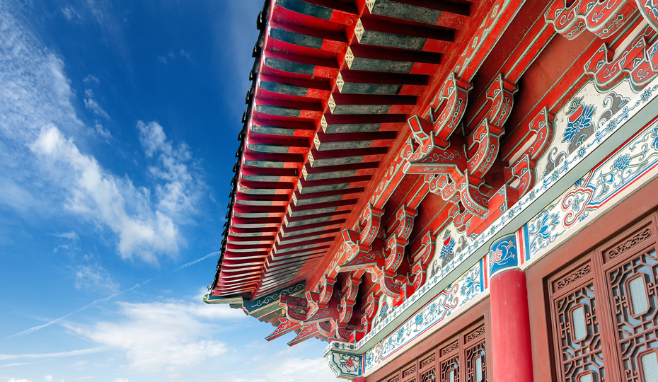 A Chinese Pavilion arch against a clear blue sky