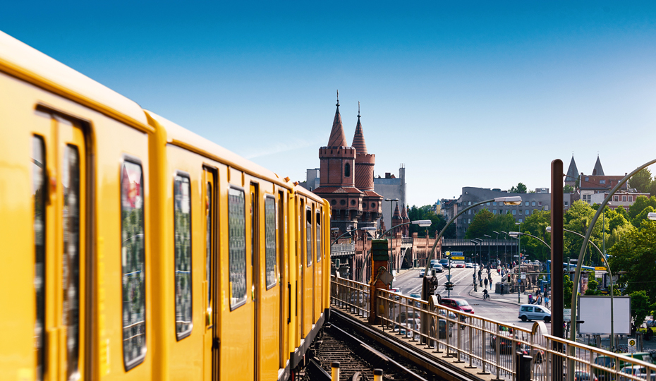 A tram in Berlin going over a bridge